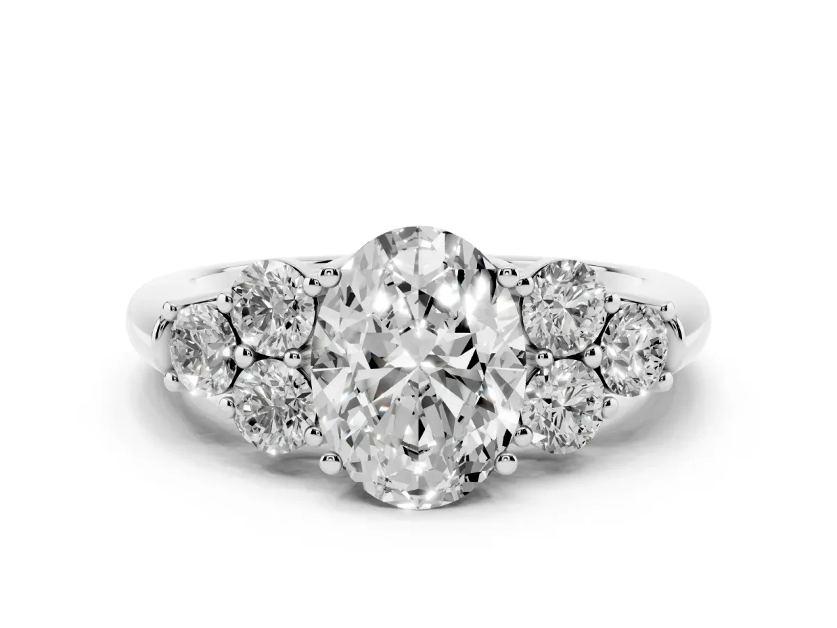 Oval Cut Cut Diamond Cluster Ring with Round Accent Stones and Prong Setting on a Classic Band White gold