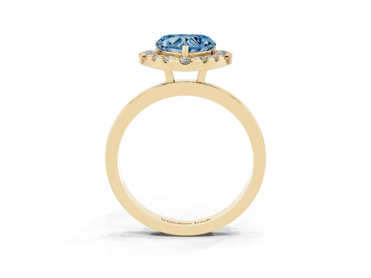 Fancy Blue Heart Cut Halo Diamond Solitaire with Pavé Band and Four-Prong Setting Yellow gold