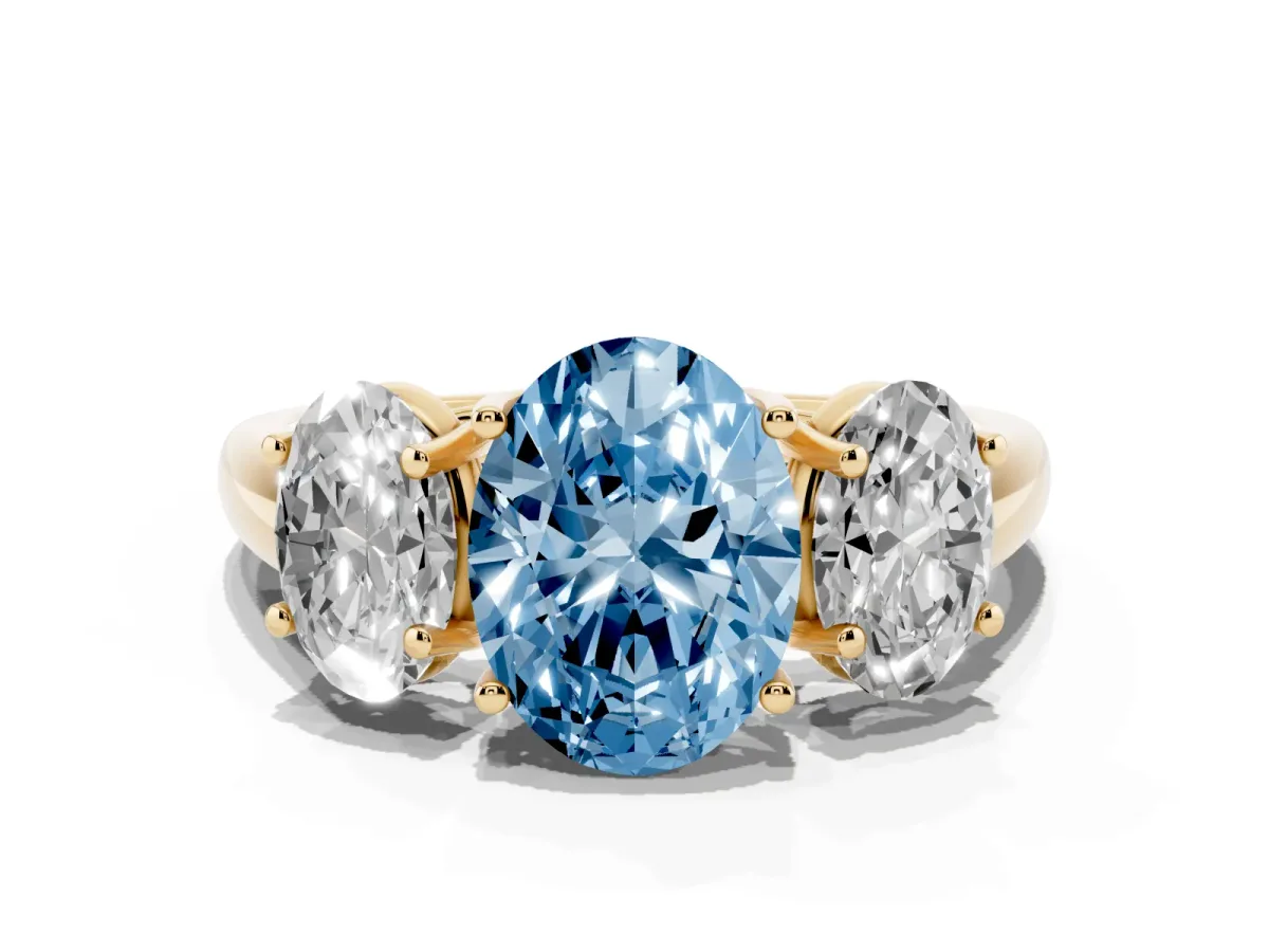 Fancy Blue Three-Stone Oval Cut Diamond Engagement Ring with Prong Setting Yellow gold