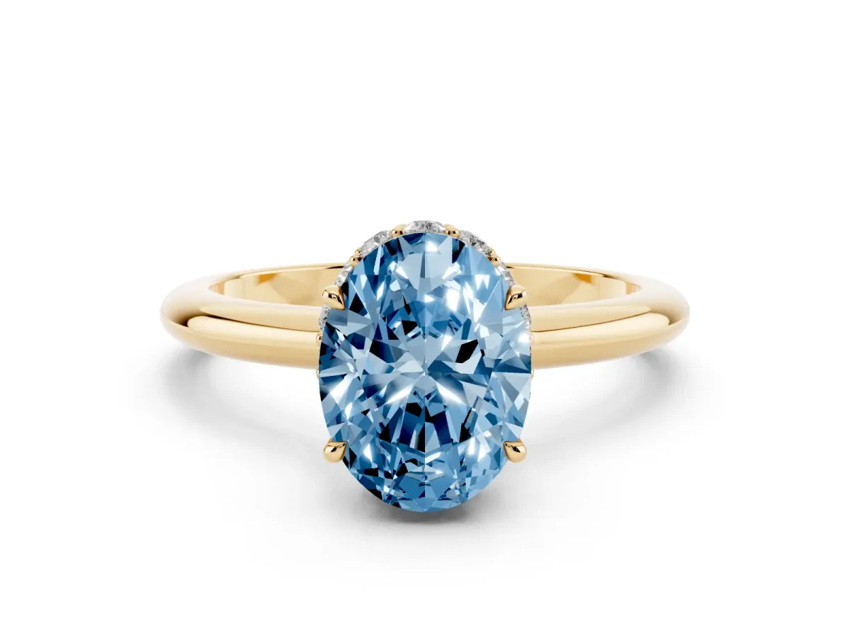 Fancy Blue Oval Cut Brilliant Solitaire Engagement Ring with Six-Prong Setting and Classic Band Yellow gold