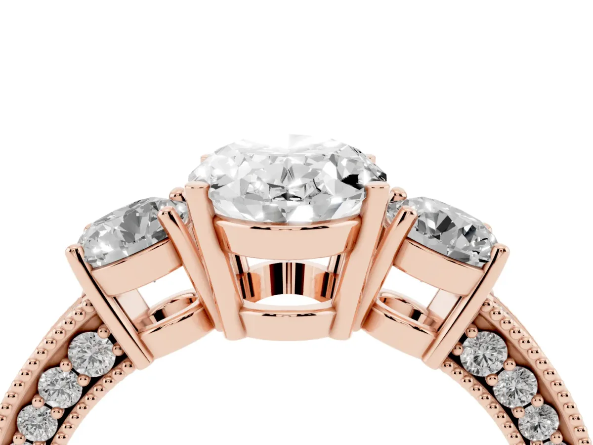 Oval Cut Three-Stone Diamond Ring with Pavé Band and Four-Prong Setting Rose gold