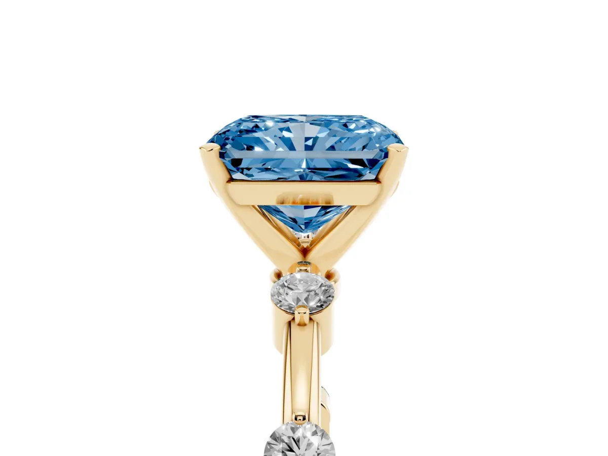 Fancy Blue Radiant Cut Solitaire Diamond Ring with Bezel Set Side Stones and Prong Setting Yellow gold