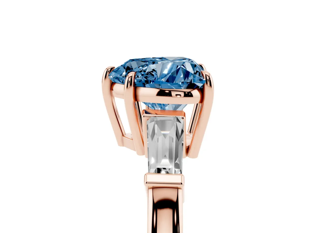 Fancy Blue Heart Cut Diamond Three-Stone Ring with Tapered Baguette Side Stones and Prong Setting Rose gold