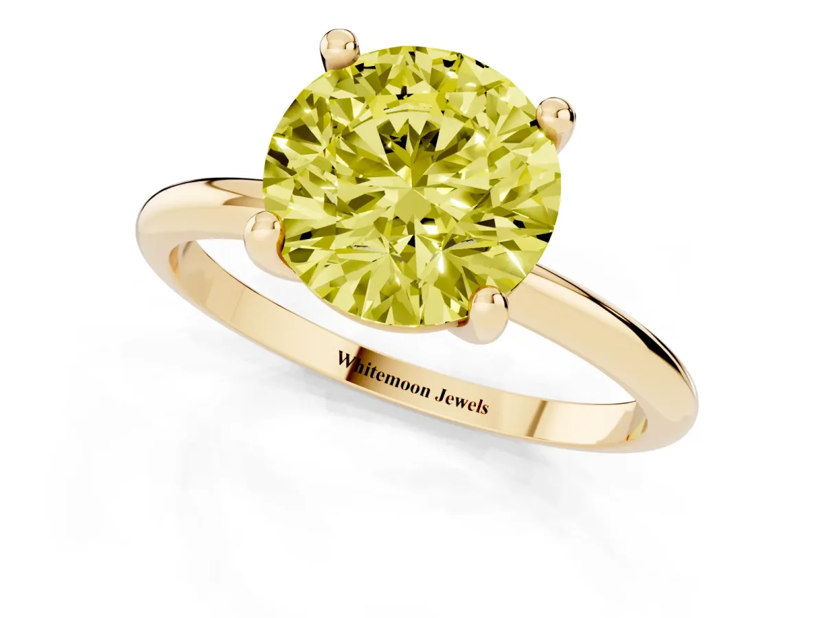 Fancy Yellow Round Cut Solitaire Diamond Ring with 4-Prong Setting on a Classic Band Yellow gold