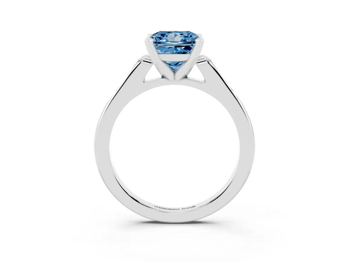 Fancy Blue Princess Cut Diamond Solitaire Ring with Channel Set Round Band and Prong Setting Silver