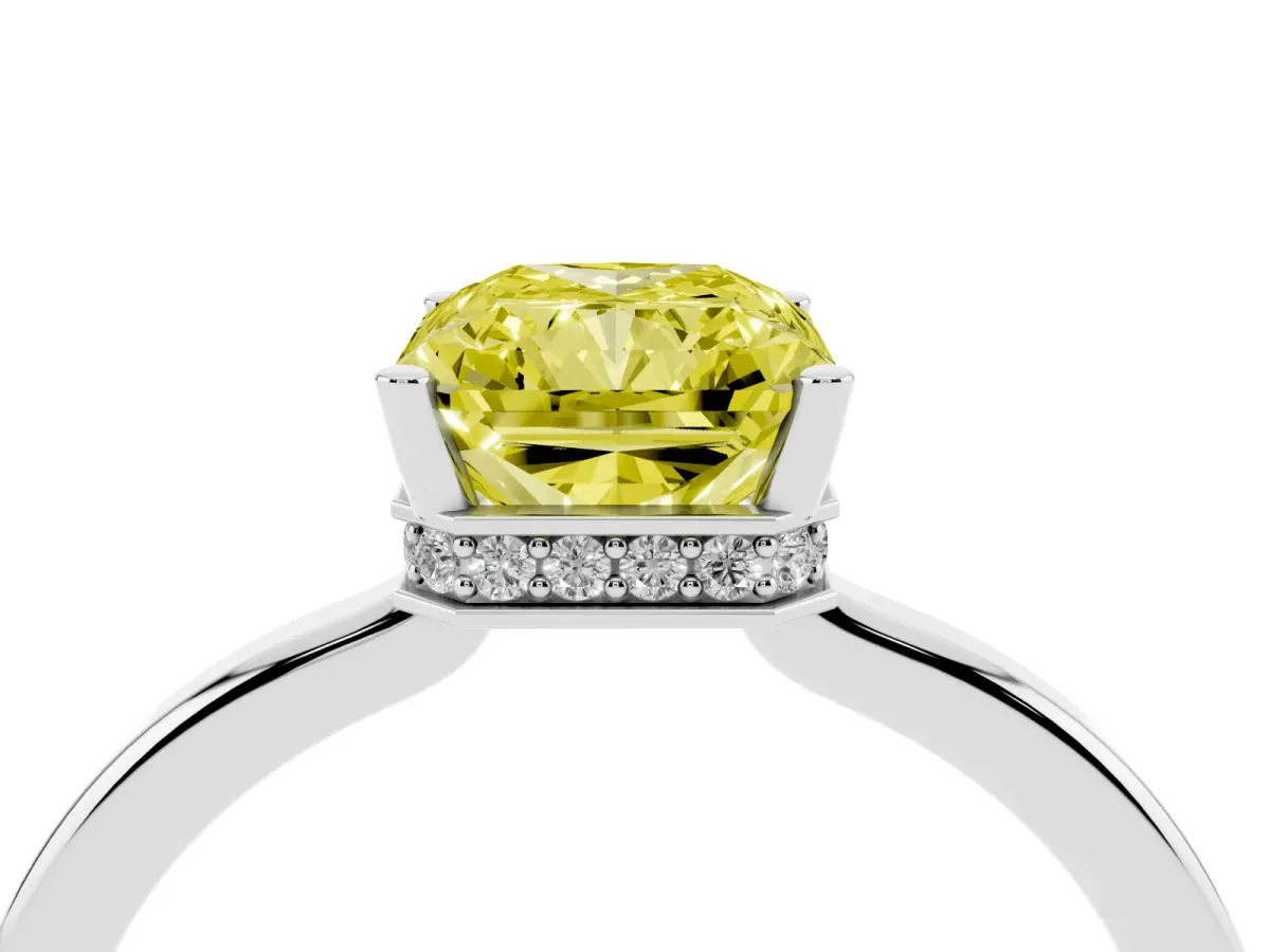 Fancy Yellow Radiant Cut Cut Solitaire Engagement Ring with Four-Prong Setting on a Classic Band Silver
