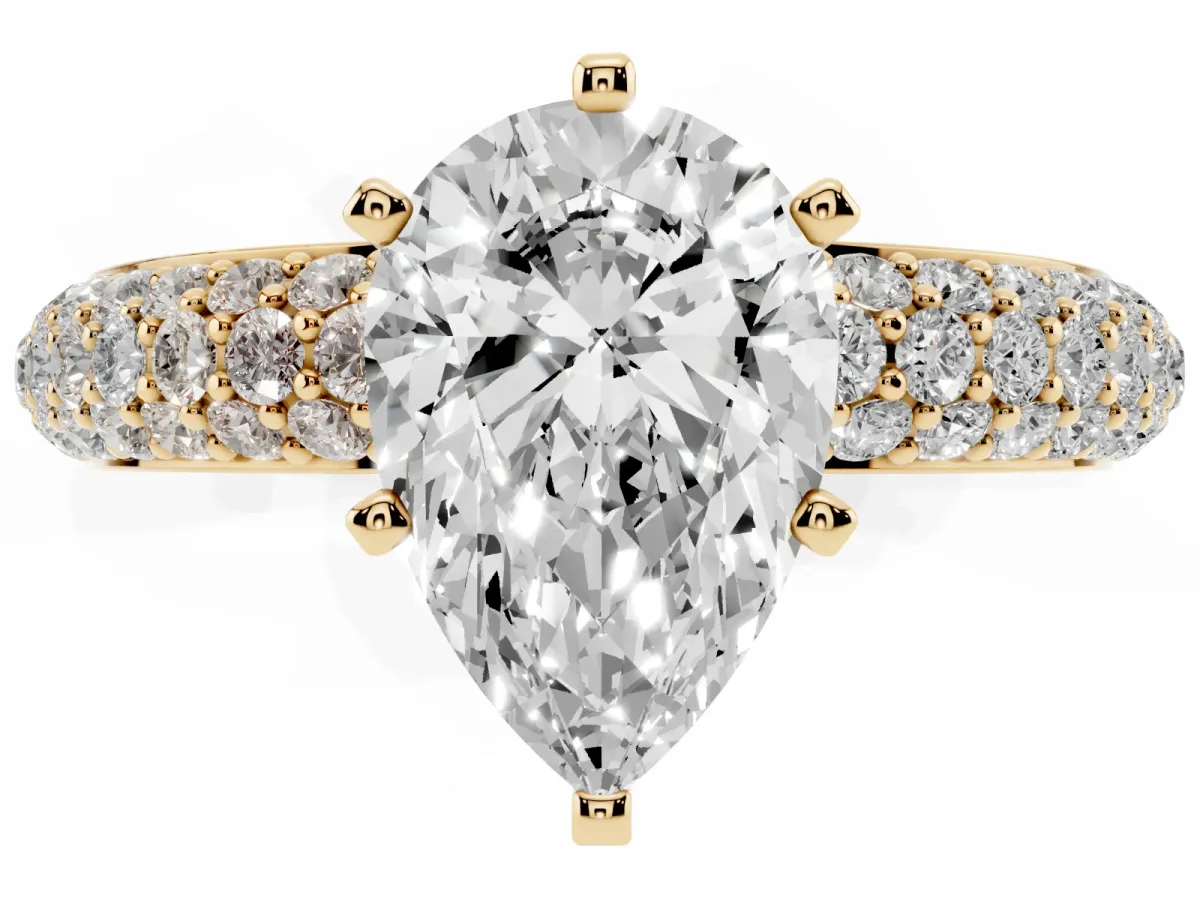 Pear Cut Diamond Solitaire Ring with Prong Setting and Pavé Band Yellow gold