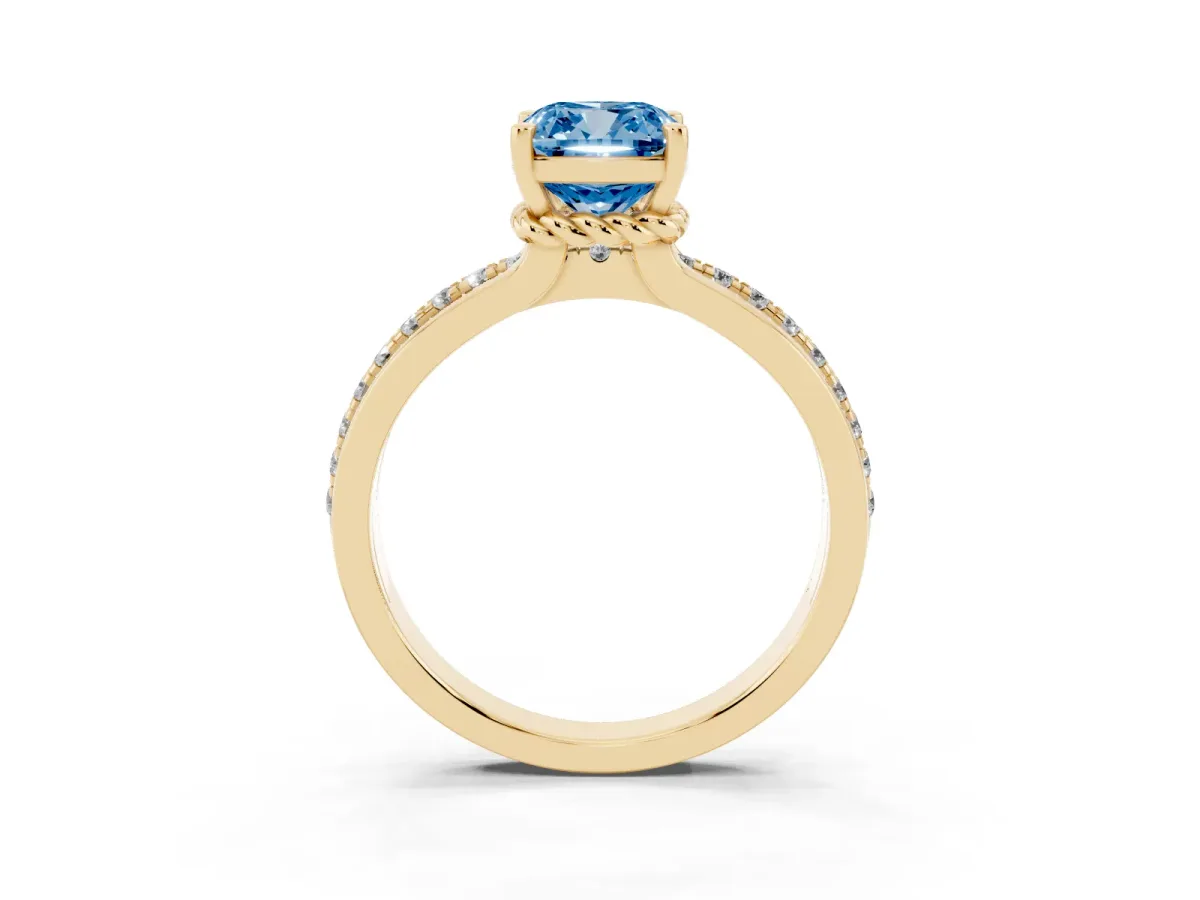 Fancy Blue Cushion Cut Solitaire Diamond Ring with Channel Set Band and Six-Prong Setting Yellow gold