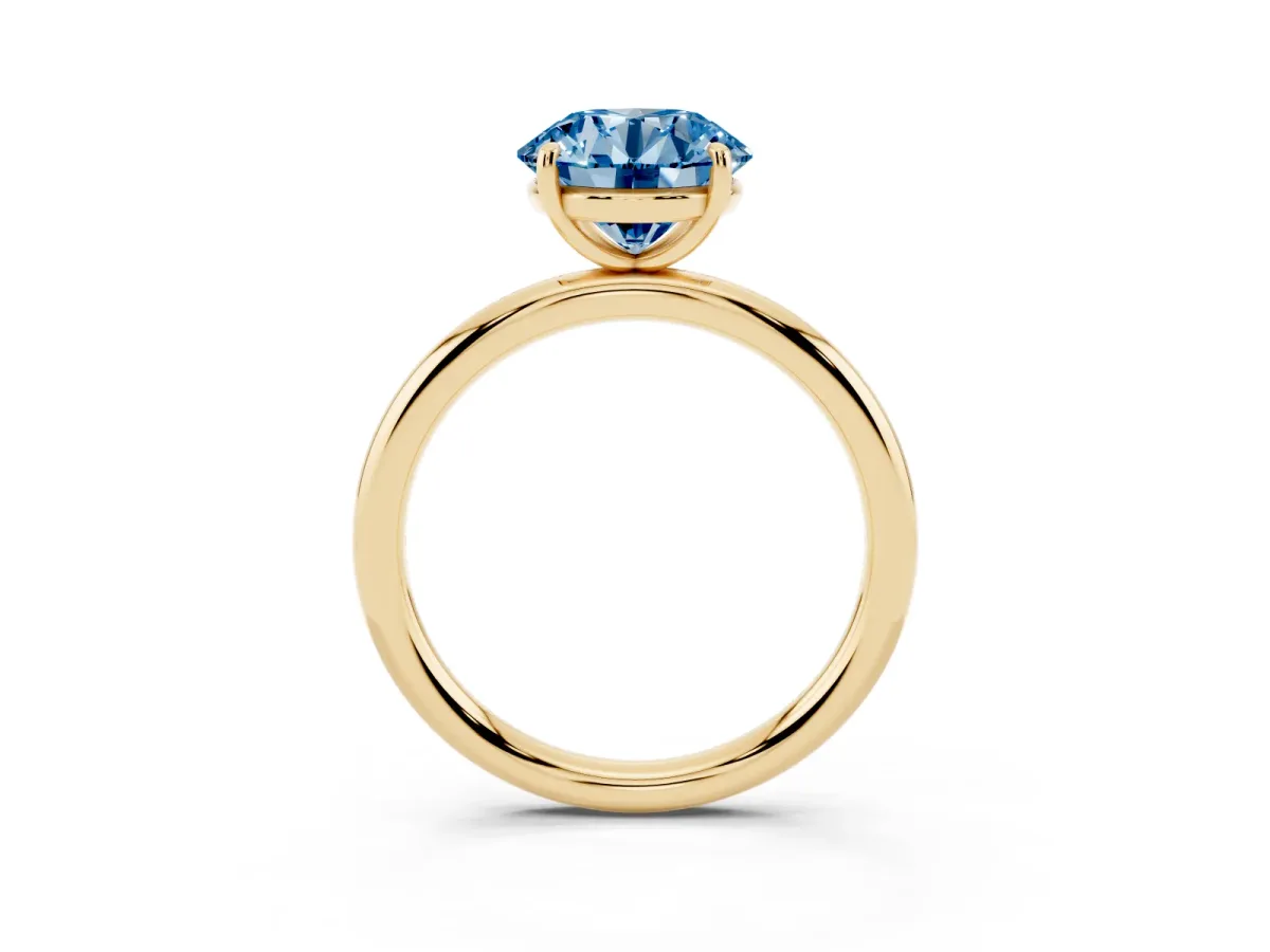Fancy Blue Round Cut Solitaire Diamond Ring with Four-Prong Setting on a Plain Band Yellow gold