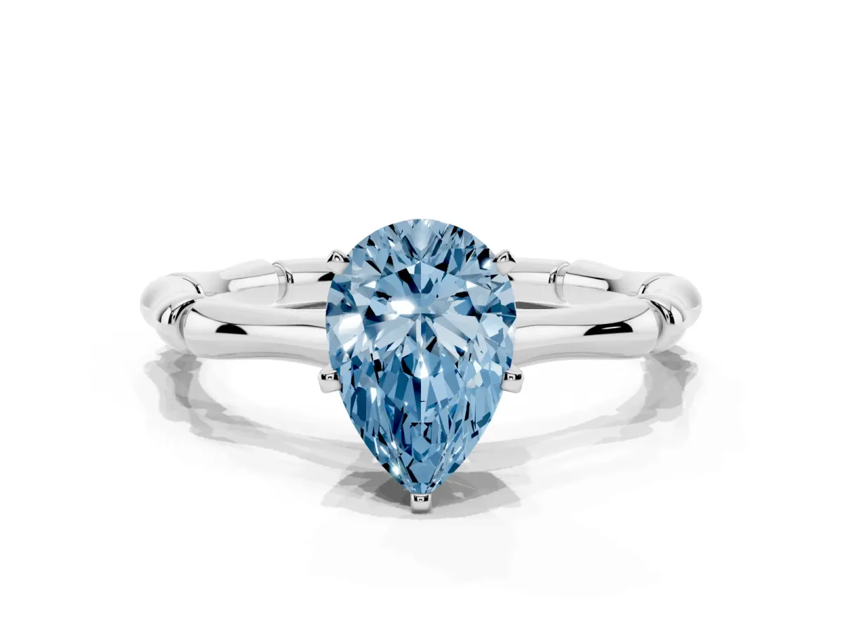Fancy Blue Pear Cut Solitaire Diamond Ring with Bamboo Band and Four-Prong Setting Platinum