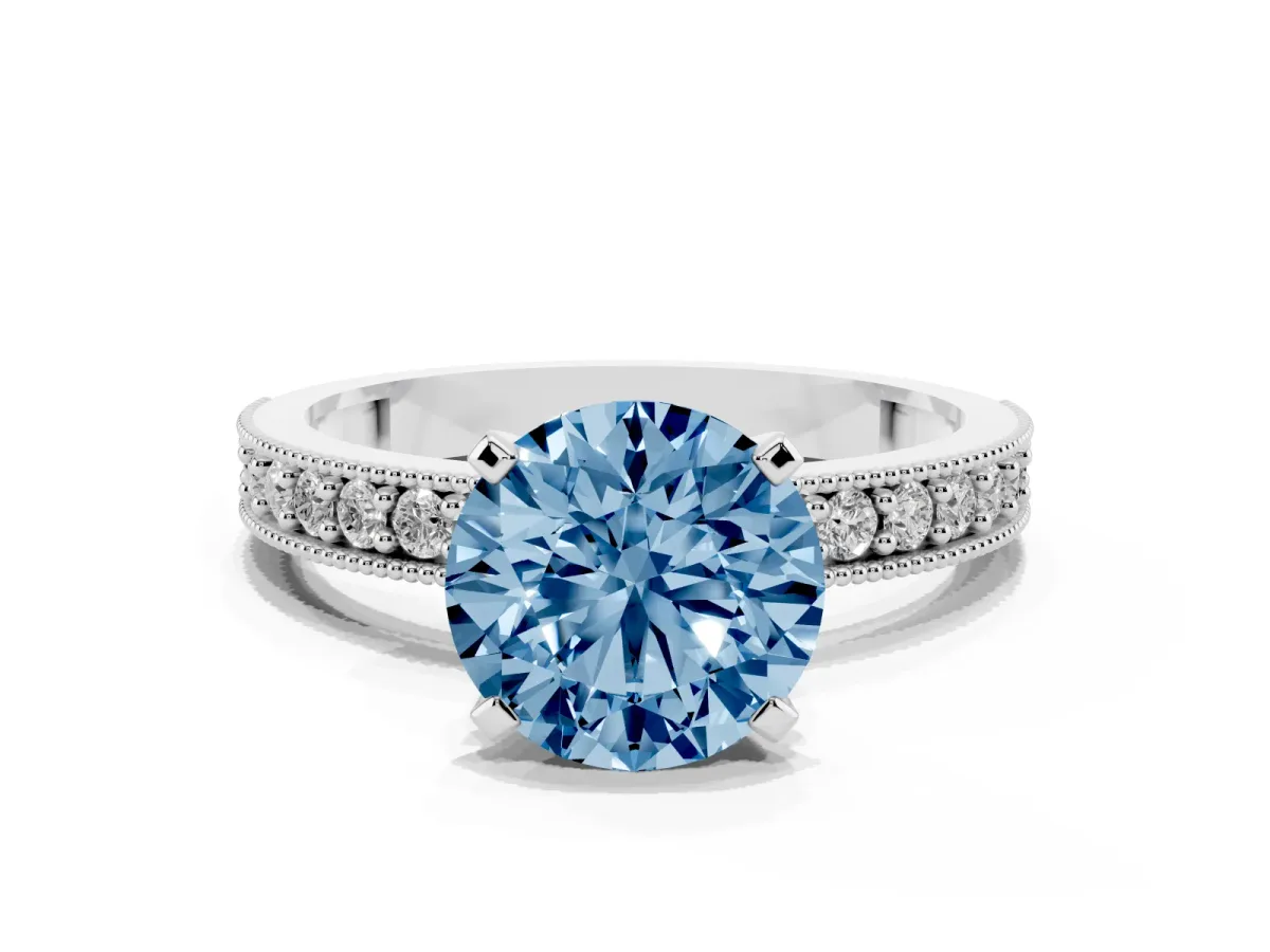 Fancy Blue Round Cut Diamond Milgrain Pavé Engagement Ring with Four-Prong Setting Silver