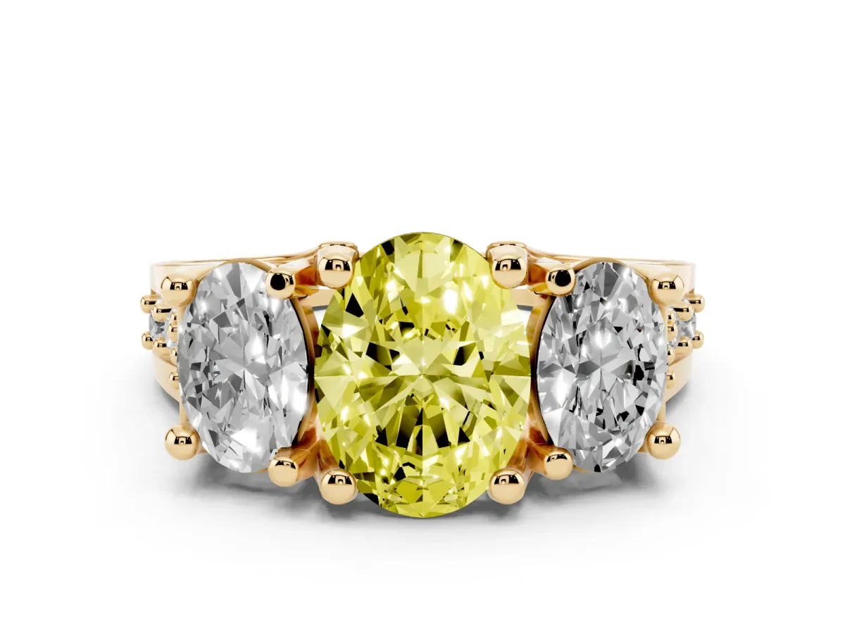 Fancy Yellow Oval Cut Diamond Three-Stone Ring with Channel Set Band and Four-Prong Setting Yellow gold