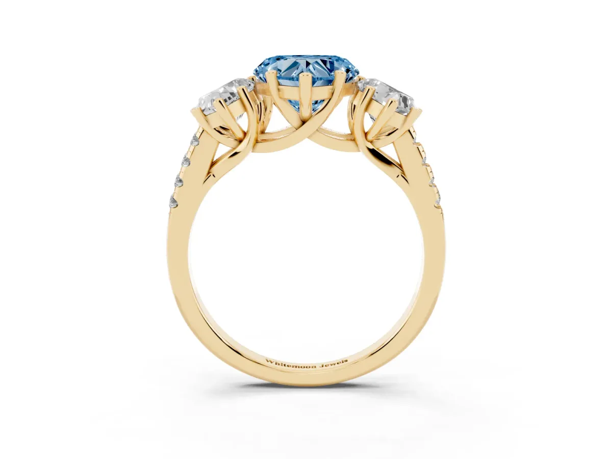 Fancy Blue Three-Stone Heart Cut Diamond Ring with Round Pavé Band and Prong Setting Yellow gold