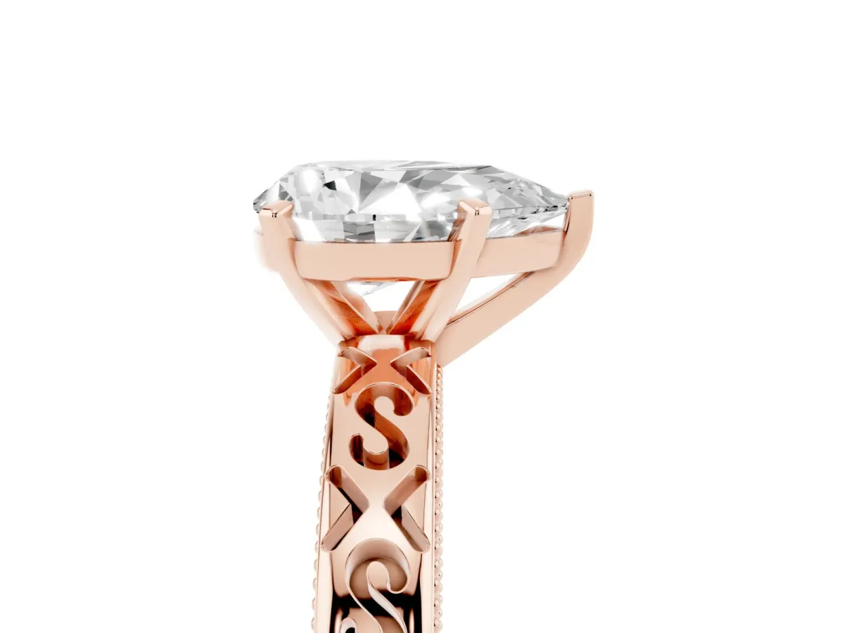 Pear Cut Solitaire Engagement Ring with Scrollwork Band and Four-Prong Setting Rose gold