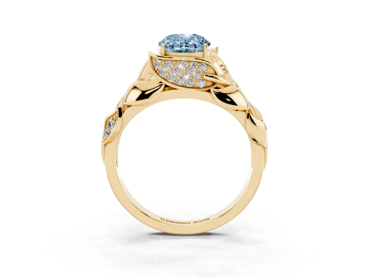 Fancy Blue Oval Cut Diamond Leaf-Inspired Engagement Ring with Round Accents and Prong Setting Yellow gold