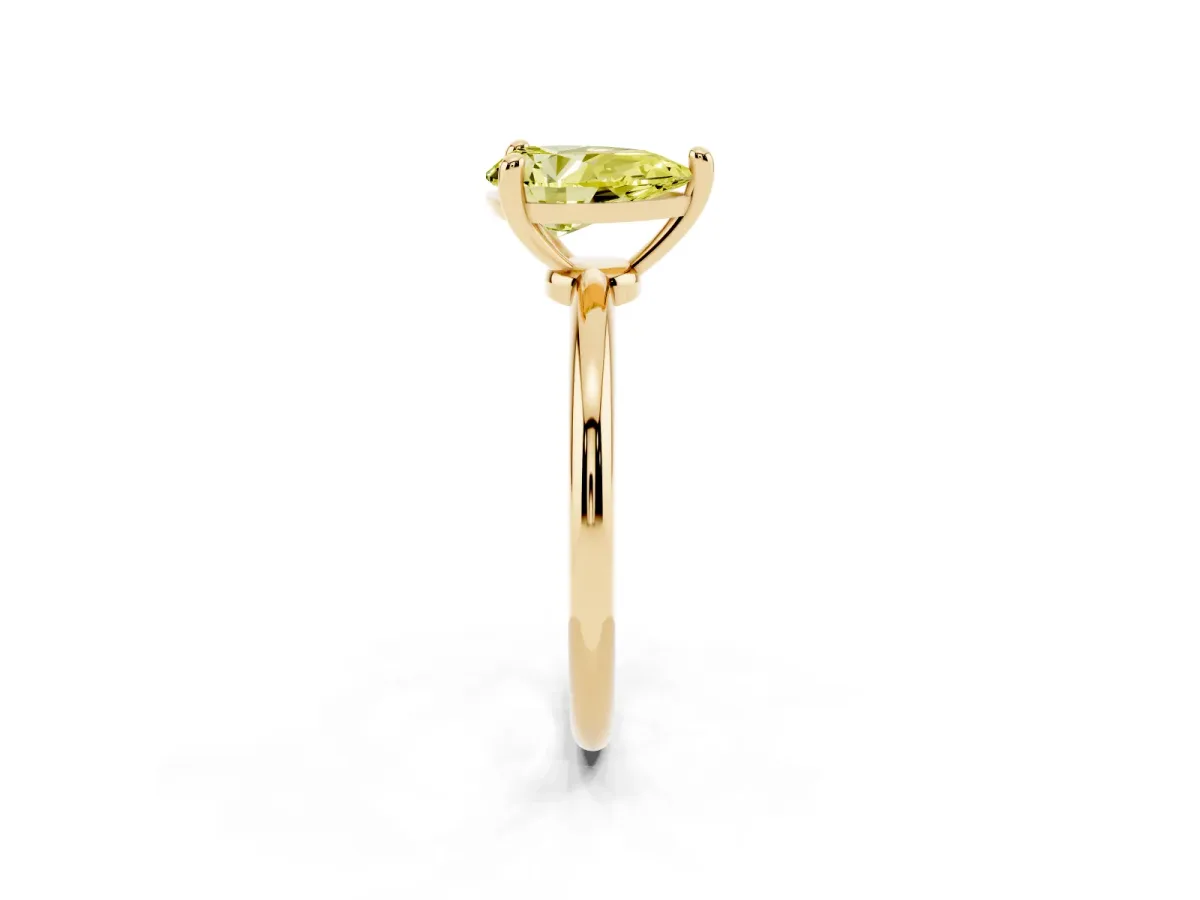 Fancy Yellow Pear Cut Solitaire Diamond Ring with 4-Prong Setting on a Classic Band Yellow gold