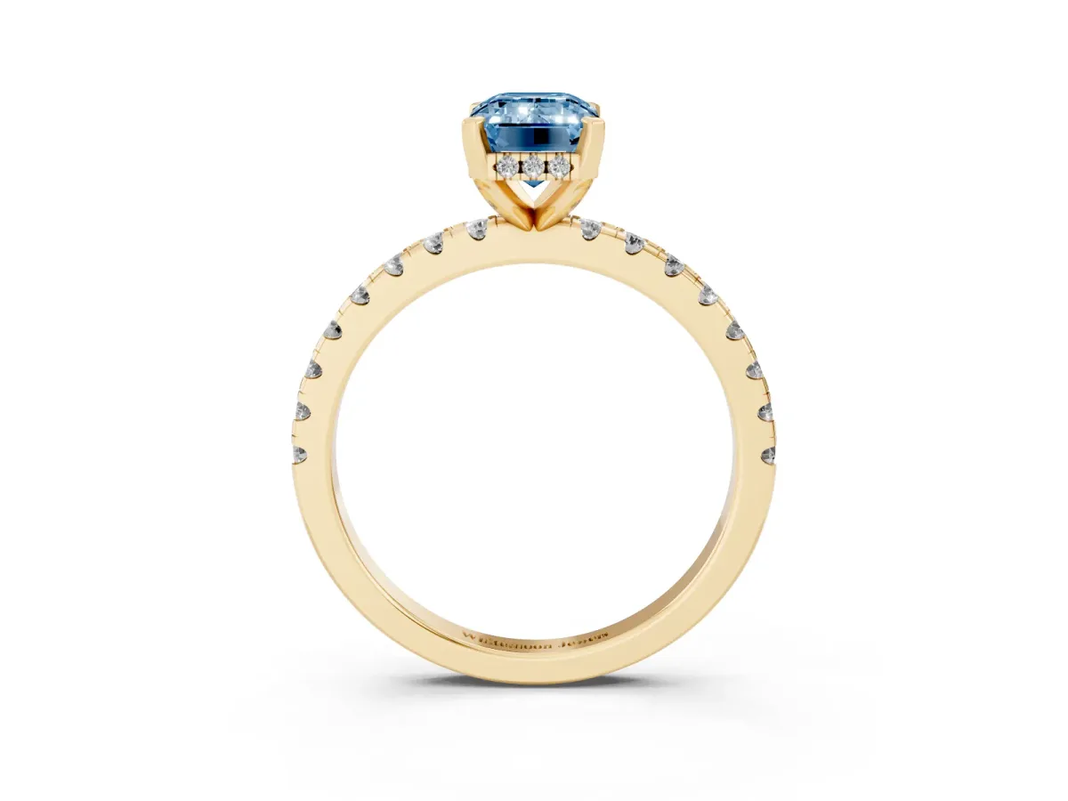 Fancy Blue Emerald Cut Diamond Solitaire Ring with Round Pavé Band and Four-Prong Setting Yellow gold