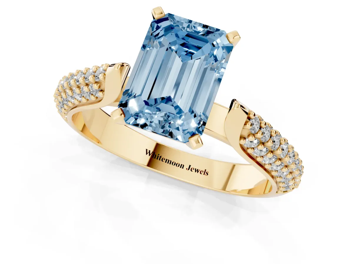 Fancy Blue Emerald Cut Diamond Solitaire Engagement Ring with Multi-Row Round Pavé Band and Prong Setting Yellow gold