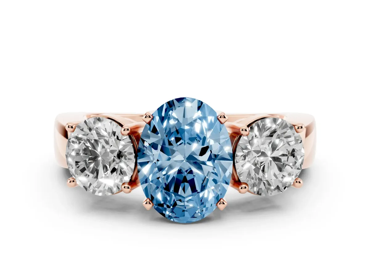 Fancy Blue Three-Stone Oval Cut Diamond Ring with Round Side Stones, Classic Band, and Four-Prong Setting Rose gold