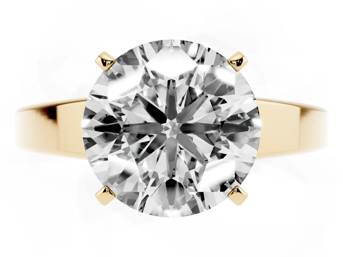 Round Cut Solitaire Engagement Ring with Four-Prong Setting and Tapered Band Yellow gold