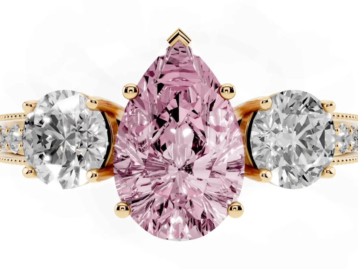 Fancy Pink Pear Cut Three-Stone Diamond Ring with Pavé Band and Four-Prong Setting Yellow gold