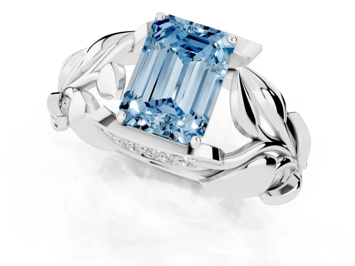 Fancy Blue Emerald Cut Diamond Leaf-Inspired Engagement Ring with Round Accents and Prong Setting Silver