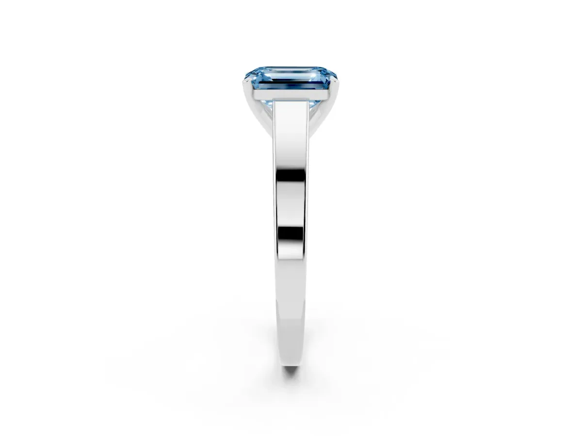 Fancy Blue Emerald Cut Solitaire Engagement Ring with Four-Prong Setting and Tapered Band Silver