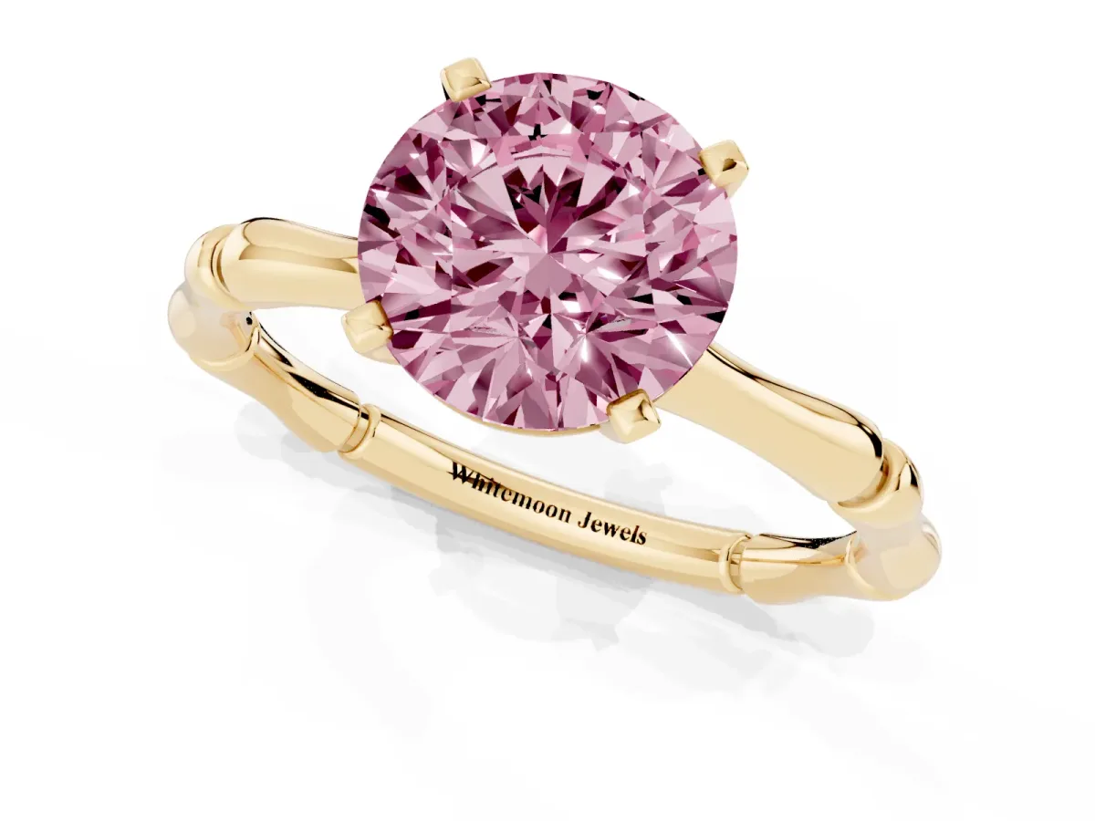 Fancy Pink Round Cut Solitaire Diamond Ring with Bamboo Band and Four-Prong Setting Yellow gold