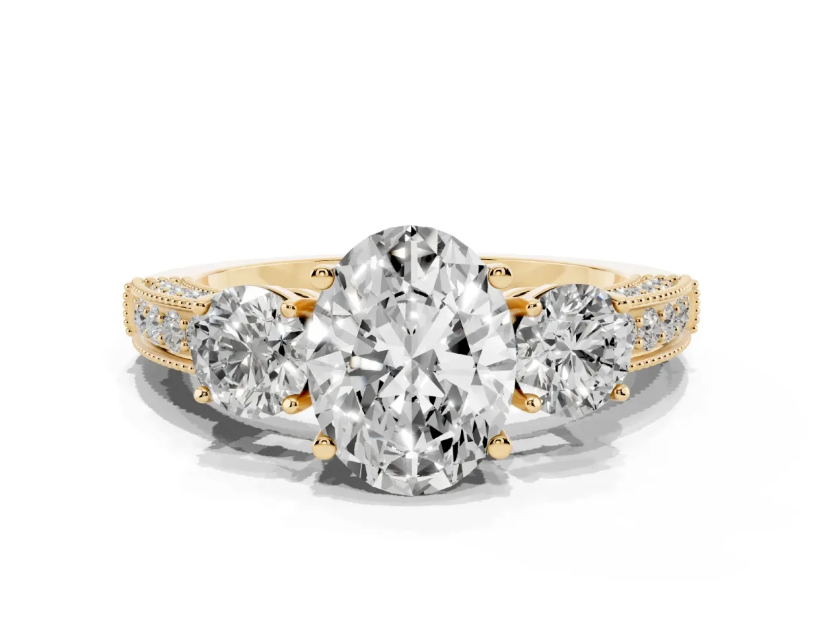 Oval Cut Three-Stone Diamond Ring with Pavé Band and Four-Prong Setting Yellow gold