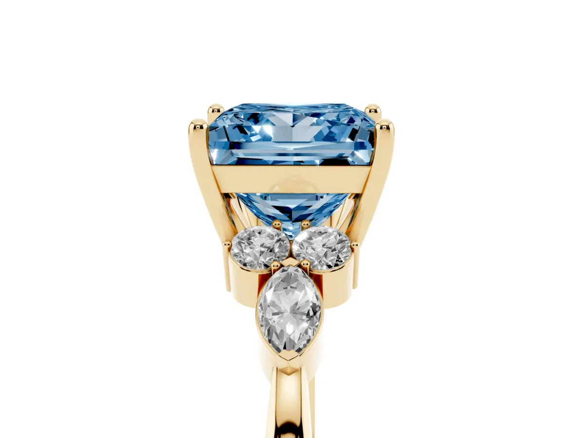 Fancy Blue Princess Cut Brilliant Diamond Solitaire Ring with Pear Side Stones and Four-Prong Setting Yellow gold