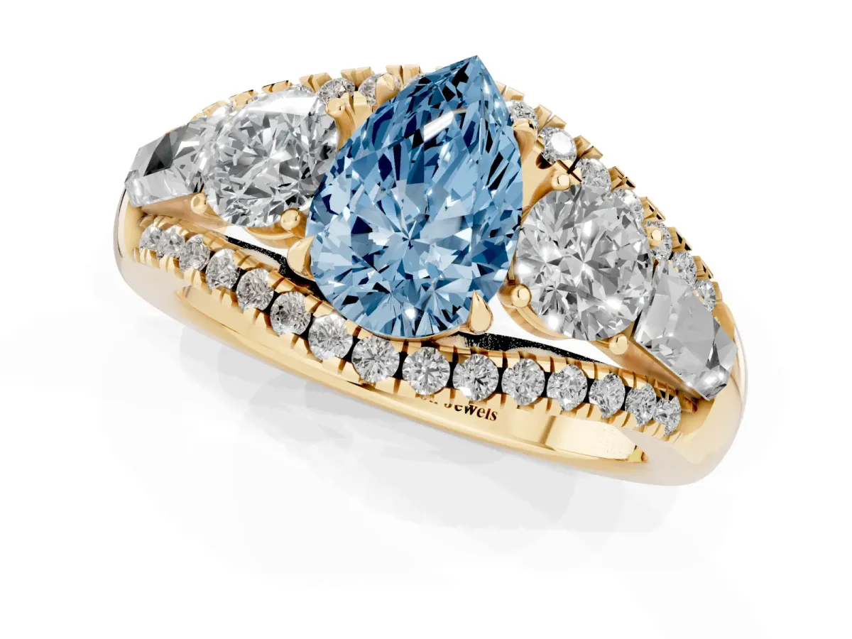 Fancy Blue Three-Stone Pear Cut Diamond Engagement Ring with Pave Band and Prong Setting Yellow gold