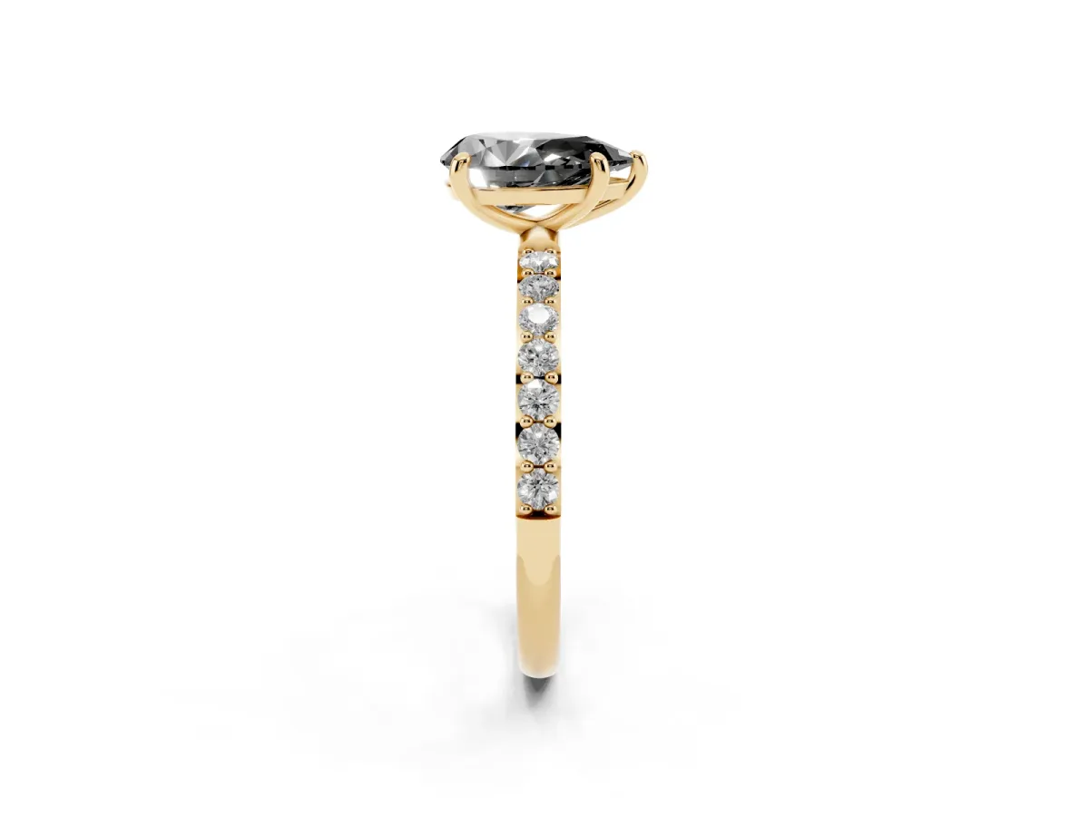 Fancy Black Pear Cut Diamond Solitaire Ring with Round Pavé Band and Prong Setting Yellow gold