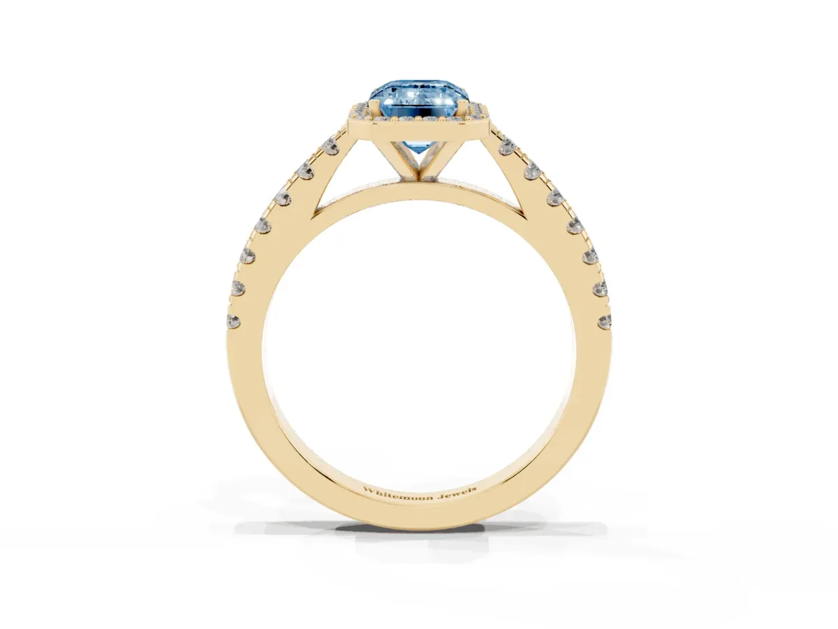 Fancy Blue Emerald Cut Cut Halo Diamond Engagement Ring with Pave Band and Four-Prong Setting Yellow gold