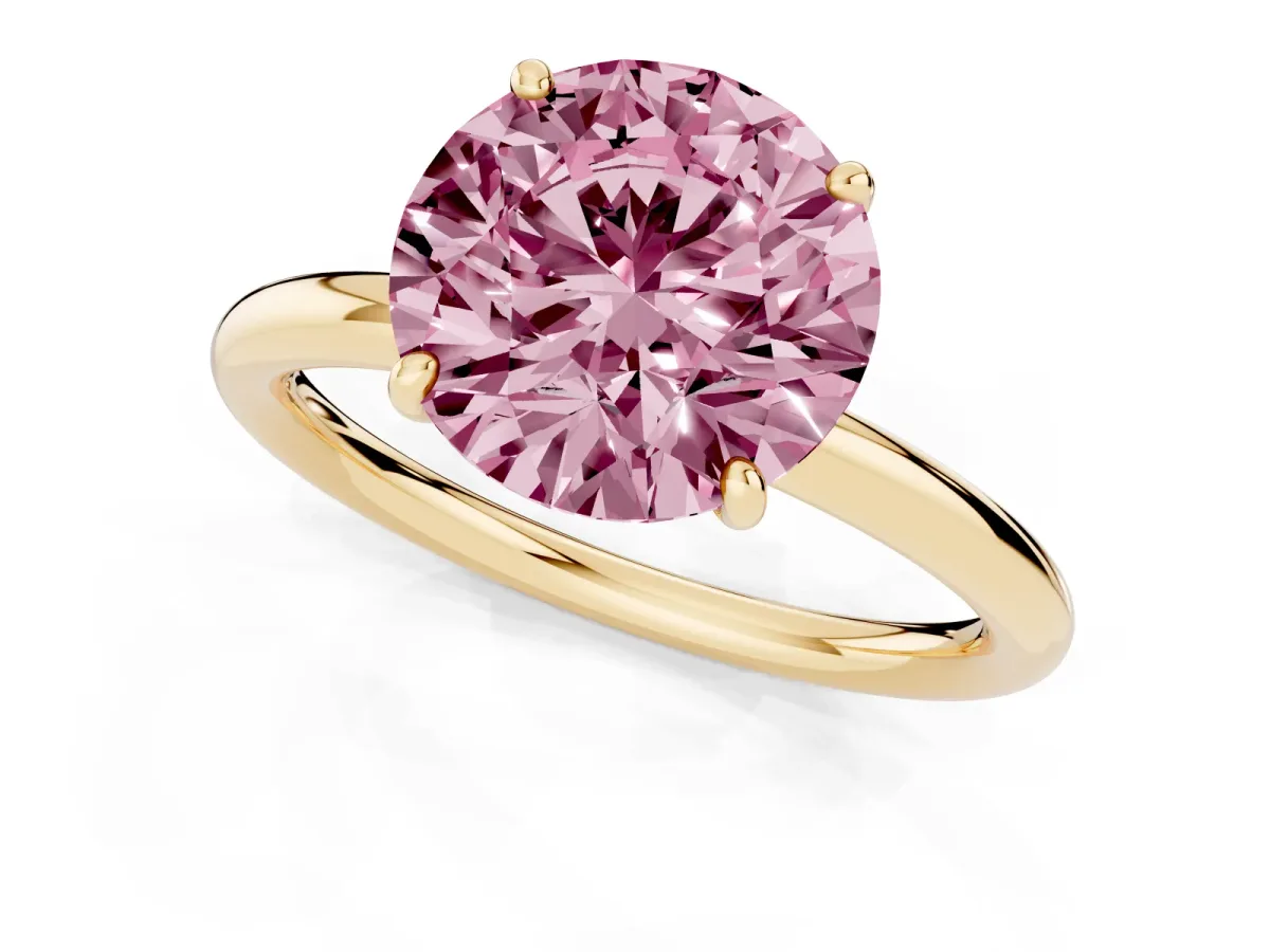 Fancy Pink Round Cut Solitaire Diamond Ring with Four-Prong Setting on a Plain Band Yellow gold
