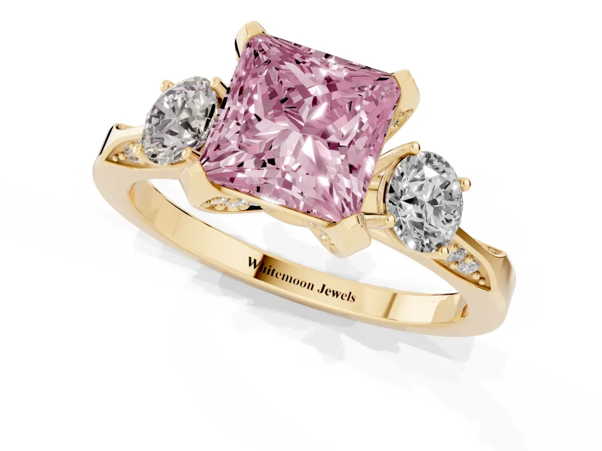 Fancy Pink Princess Cut Brilliant Three-Stone Diamond Ring with Pavé Band and Four-Prong Setting Yellow gold