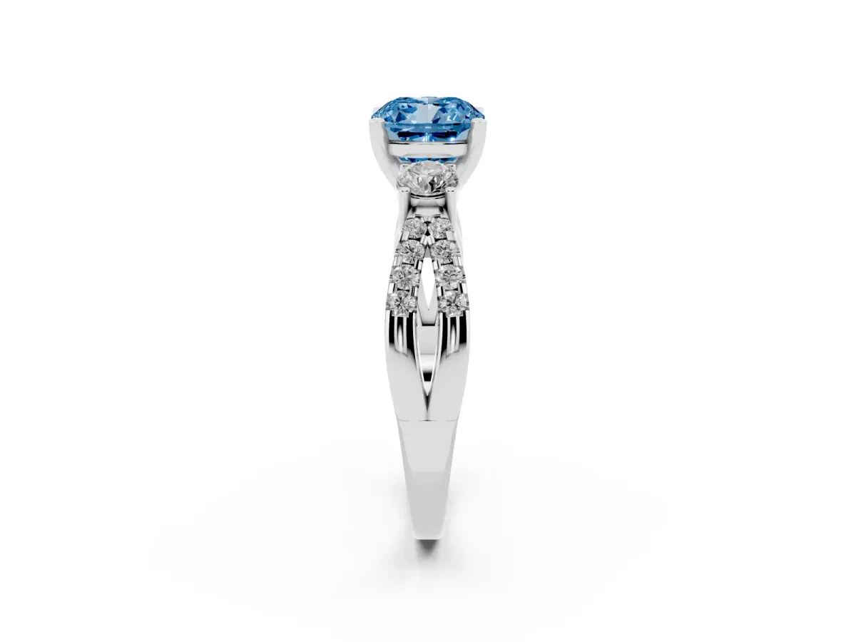 Fancy Blue Cushion Cut Diamond Three-Stone Ring with Pavé Split Shank and Four-Prong Setting Silver