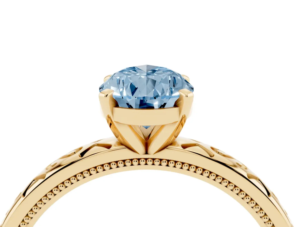 Fancy Blue Pear Cut Solitaire Engagement Ring with Scrollwork Band and Four-Prong Setting Yellow gold