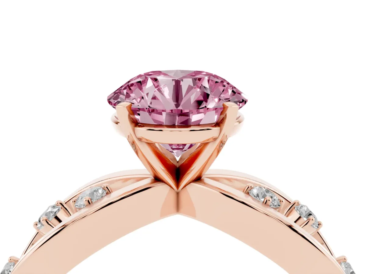 Fancy Pink Round Cut Cut Solitaire Diamond with Side Stones on Criss-Cross Band and Four-Prong Setting Rose gold