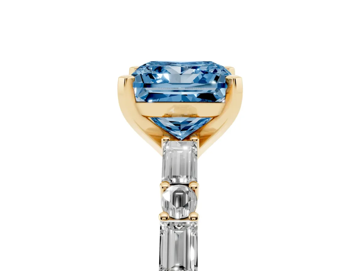 Fancy Blue Princess Cut Diamond Solitaire with Side Baguettes and Channel Set Band Yellow gold