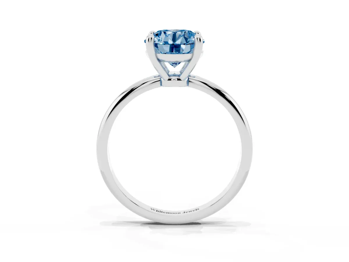 Fancy Blue Round Cut Solitaire Diamond Ring with 4-Prong Setting on a Classic Band Silver