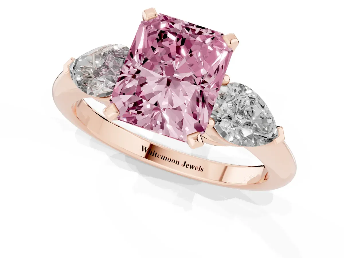 Fancy Pink Three-Stone Radiant Cut Diamond Ring with Pear Side Stones and Four-Prong Setting Rose gold