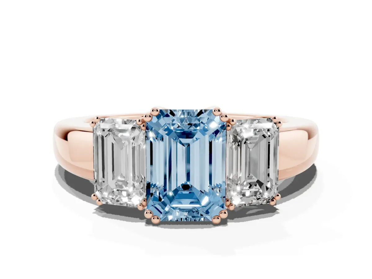 Fancy Blue Three-Stone Emerald Cut Cut Diamond Ring with Channel Set Band and Four-Prong Setting Rose gold