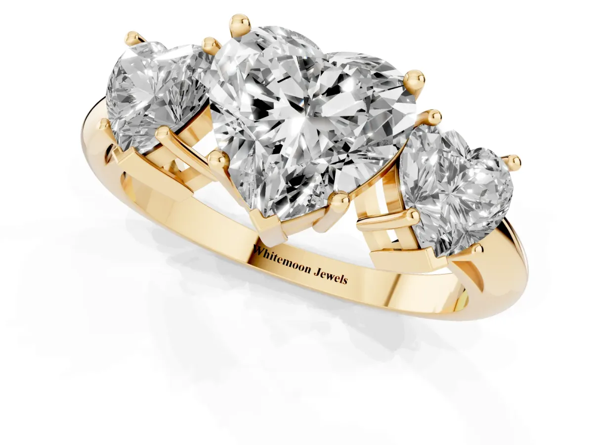 Three-Stone Heart Cut Cut Diamond Engagement Ring with Prong Setting on a White Gold Band Yellow gold