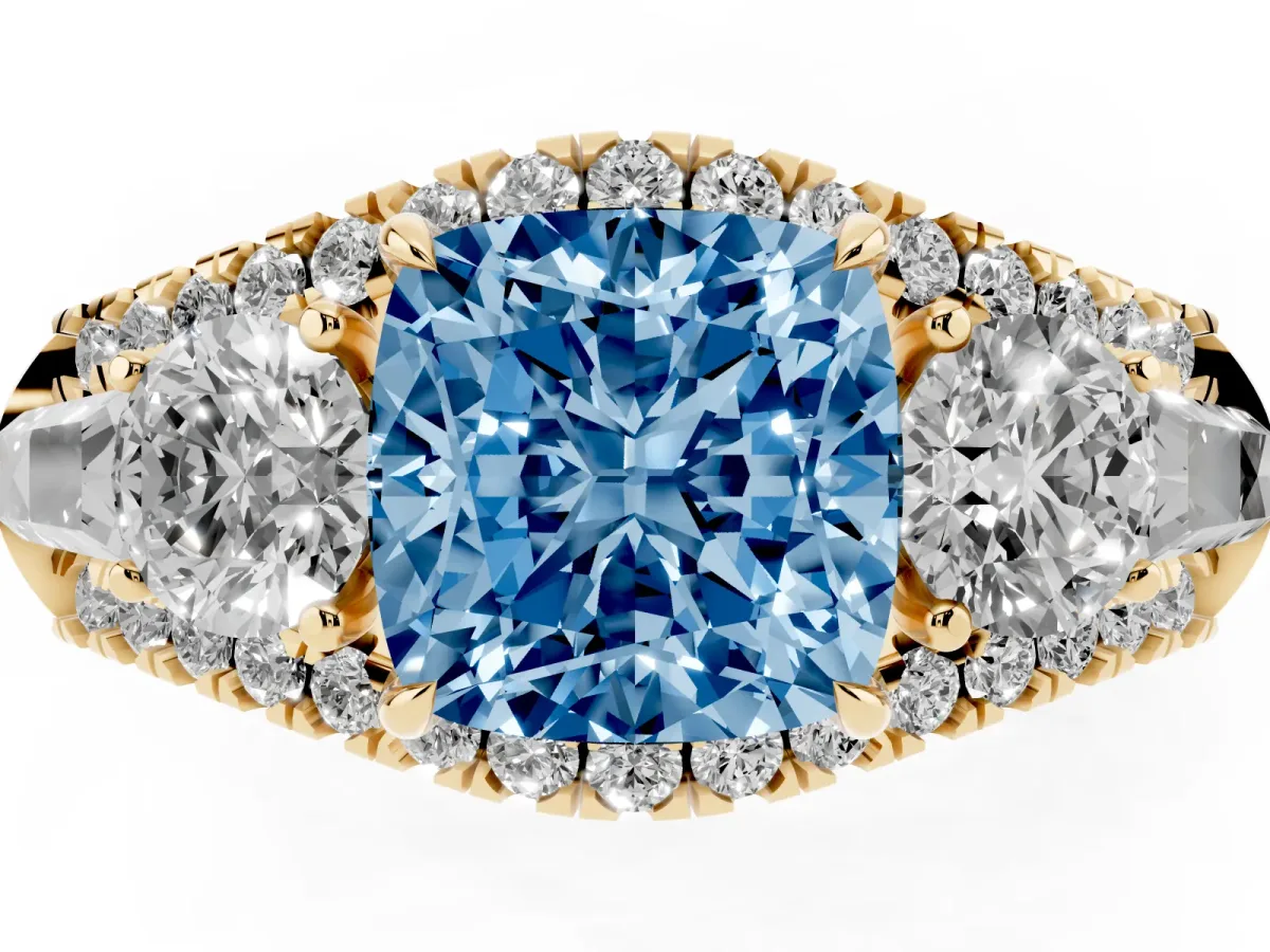 Fancy Blue Three-Stone Cushion Cut Diamond Engagement Ring with Pave Band and Prong Setting Yellow gold