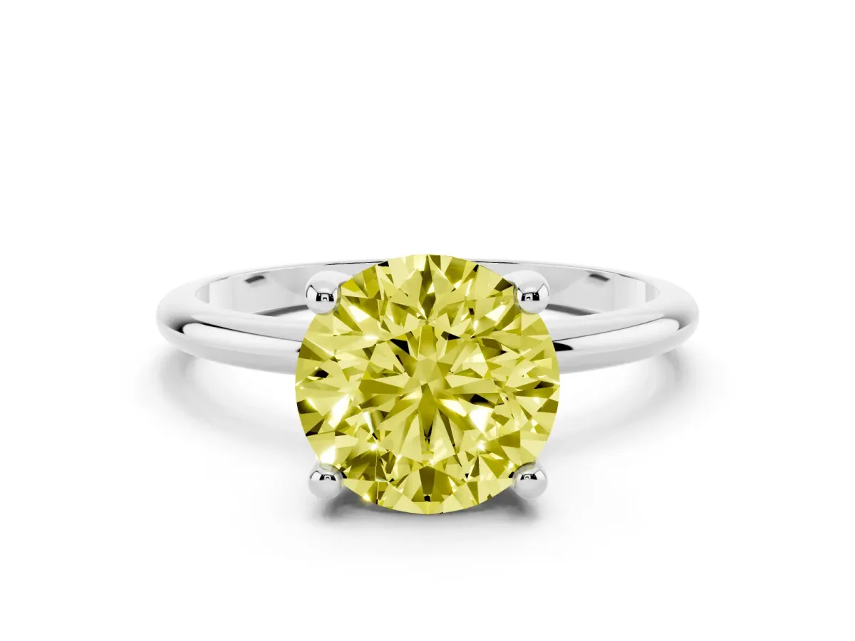 Fancy Yellow Round Cut Solitaire Diamond Ring with 4-Prong Setting on a Classic Band Silver