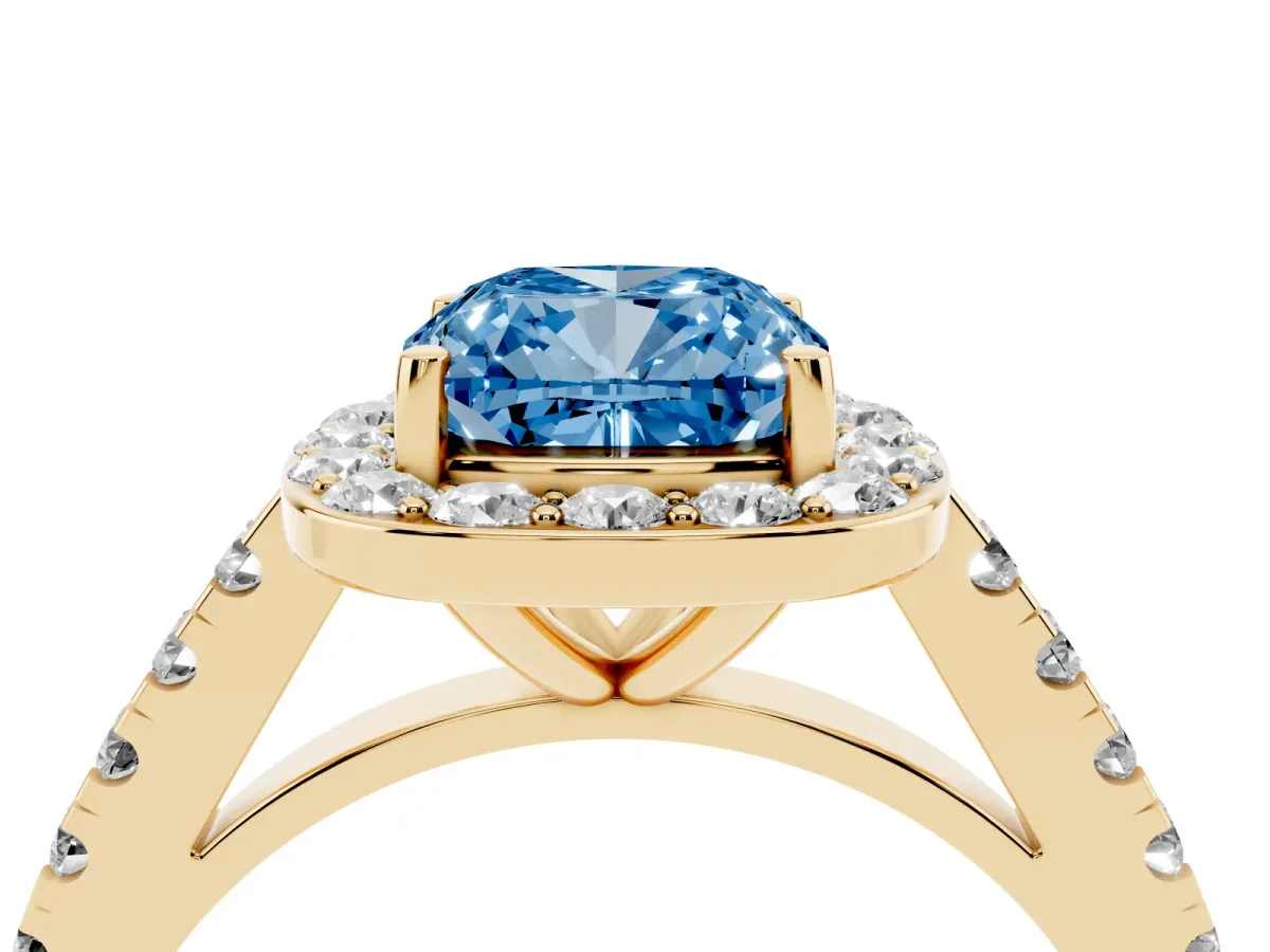 Fancy Blue Cushion Cut Diamond Halo Ring with Round Pavé Split Shank and Prong Setting Yellow gold