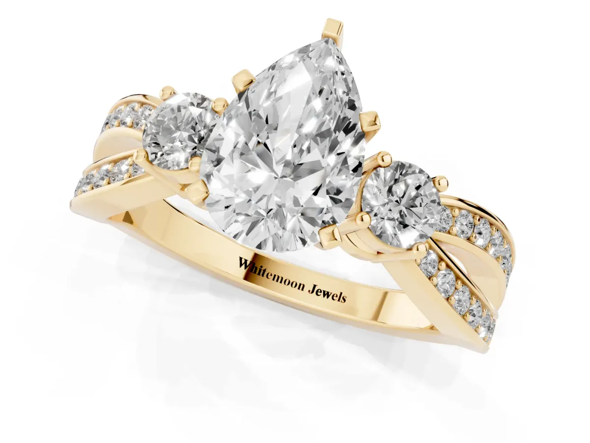 Three-Stone Pear Cut Cut Diamond Twist Band with Prong Setting Yellow gold