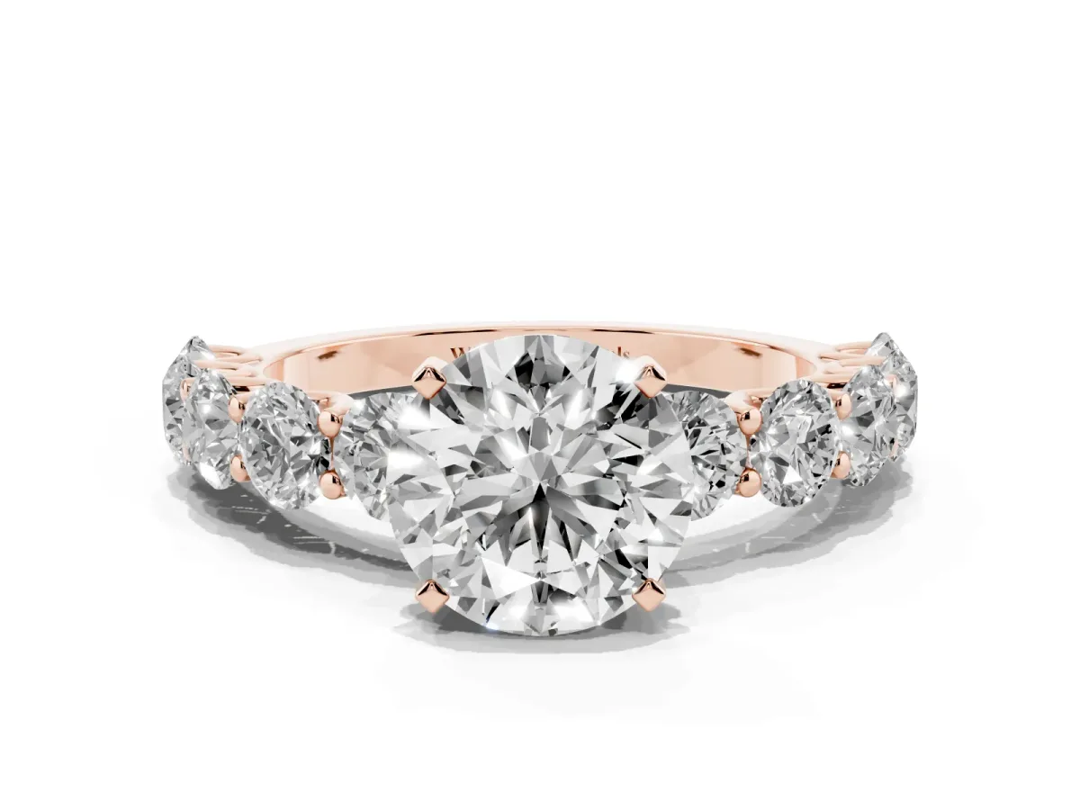 Round Cut Diamond Prong Setting with Side Stones on a Pave Band Rose gold