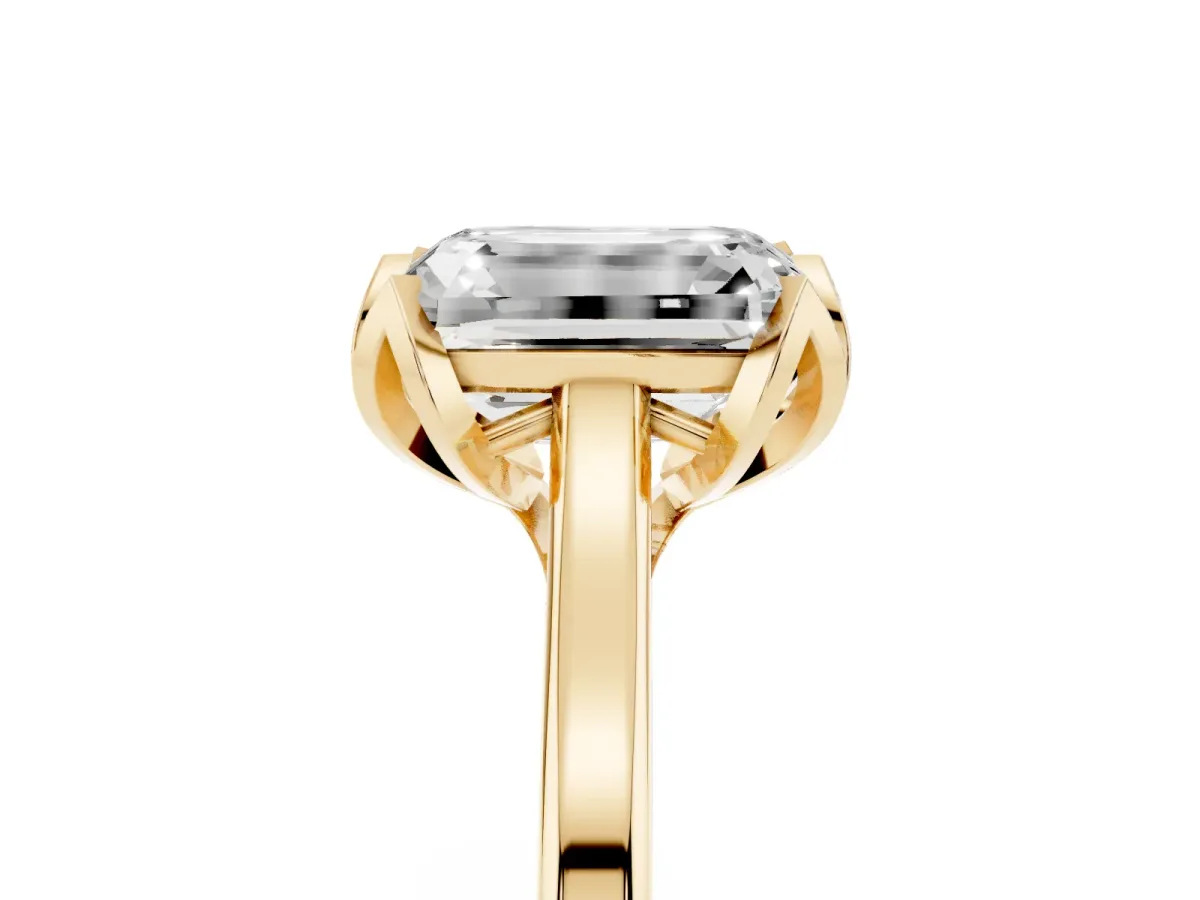 Emerald Cut Diamond Solitaire Ring with Flower Prong Setting and Classic Band Yellow gold