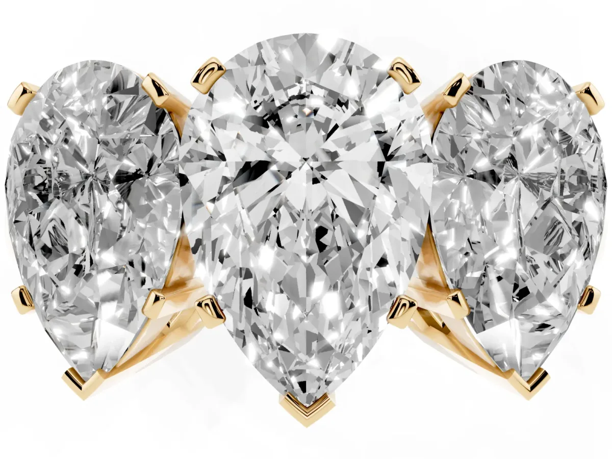 Three-Stone Pear Cut Cut Diamond Ring with Channel Set Band and Four-Prong Setting Yellow gold